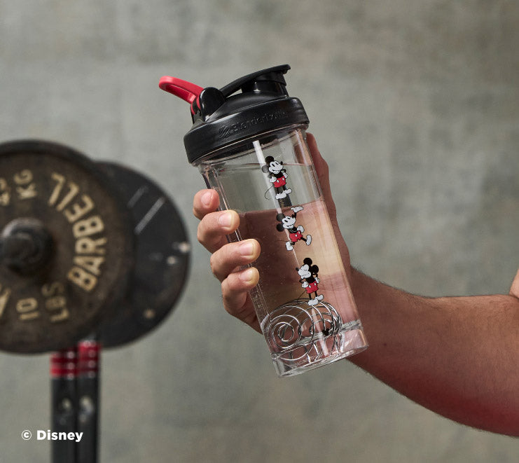 pro-series-l8 Mickey_Mouse_Protein_Shaker_Bottle_Being_Held_In_the_Gym.jpg